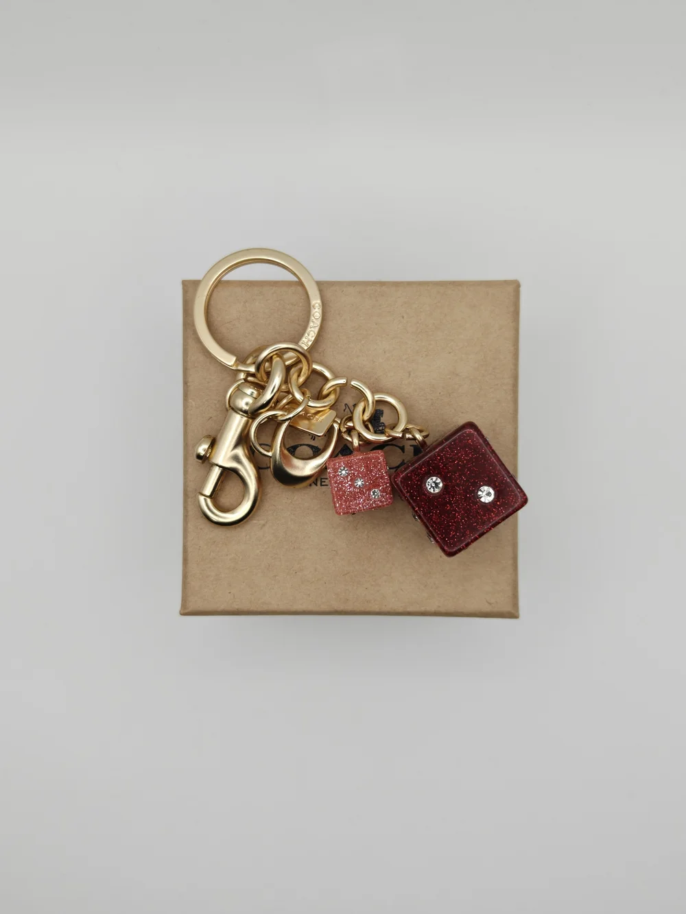 Coach Gold Keychain with Red Glitter Dice Charm